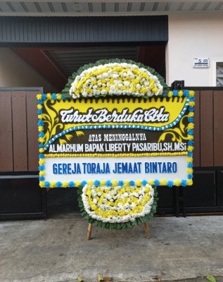 Papan Bunga Duka di Wouma